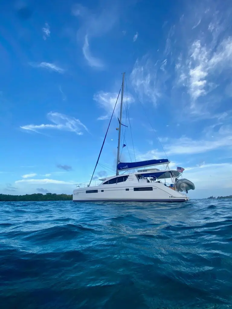yacht between blue sky and blue ocean