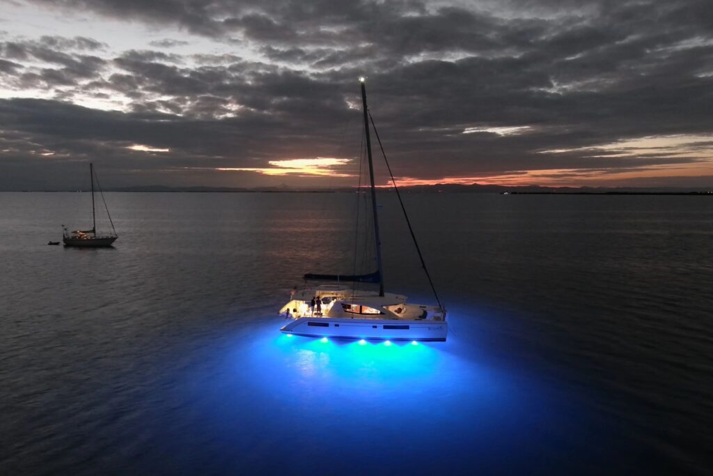 blue light under yacht