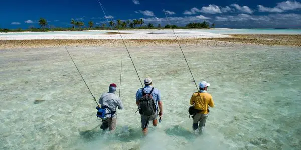 three man with fishing rod