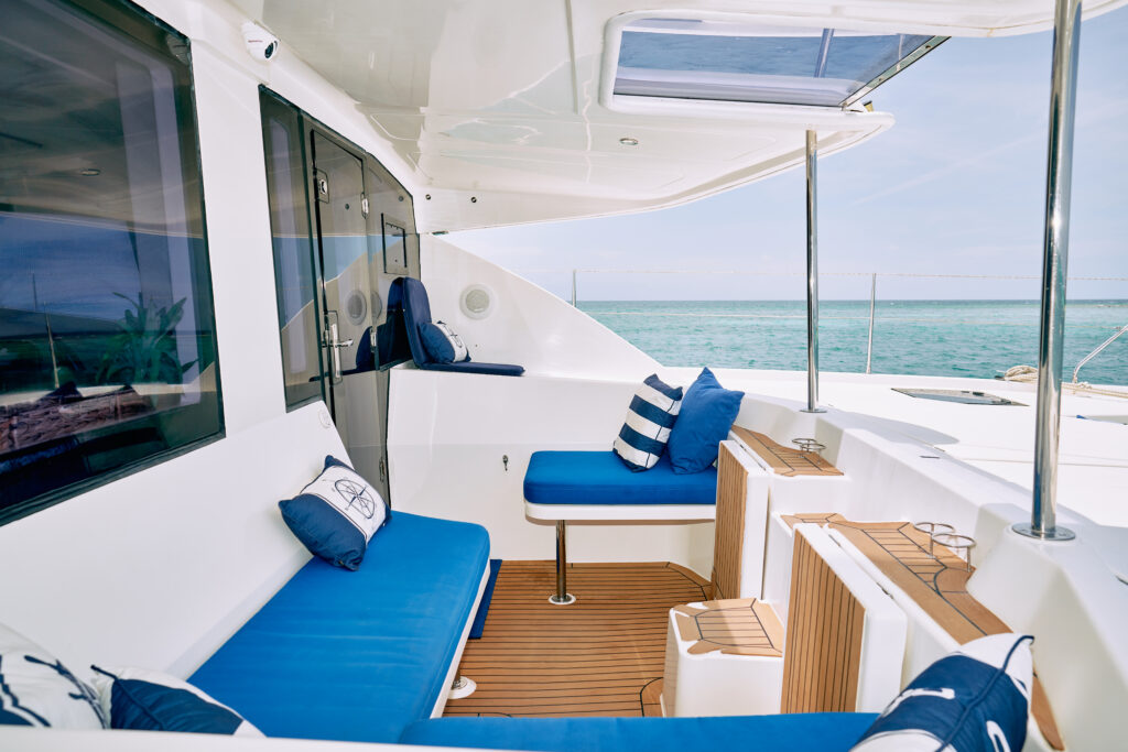 A luxury yacht with blue cushions.